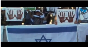 Israelis protest the Cabinet's decision to free 104 prisoners, with "blood on their hands." Photo: Tazpit News Agency, Screenshot.