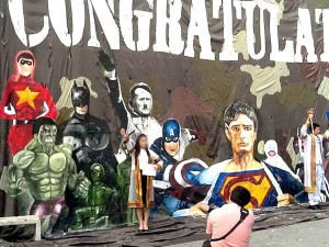 Offensive Thai student billboard, Hitler salute being emulated by a recent graduate. Photo: Simon Weisenthal Center. 