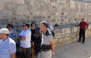 Waqf guard temple A guard from the Muslim Wafq observing Jewish visitors to the Temple Mount on August 11, 2013. Photo: The Temple Institute.