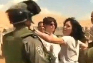 French diplomat Marion Fesneau-Castaing throwing a punch at an IDF soldier at Khirbet al-Makhul, in the Jordan Valley, on Friday, September 20, 2013. Photo: Screenshot.