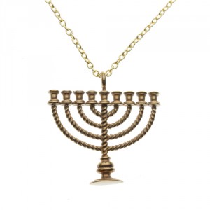 A menorah necklace by From War into Peace, which uses recycled material from nukes for Jewish jewelry. Photo: From War into Peace.