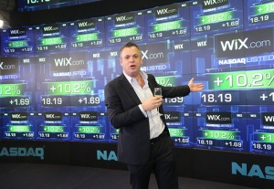 Wix CEO Avishai Abrahami speaking at NASDAQ where Wix shares were listed to trade. The website building platform claims 40 million users, including many who oppose the Jewish state. Photo: Screenshot / Wix.