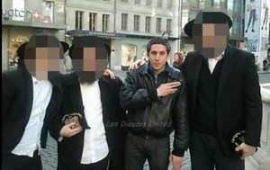 A Quenelle being photographed, unbeknownst to Chabad rabbis on a public street. Photo: Screenshot.