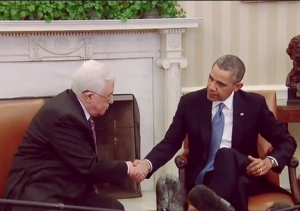 Palestinian Authority President Mahmoud Abbas shakes hands with U.S. President Barack Obama, on March 17, 2014. Photo: Screenshot.