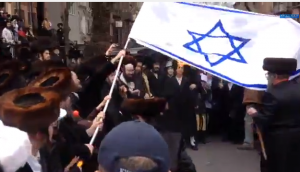 Satmar Hasidim set fire to an Israeli flag in Williamsburg, Brooklyn on Purim. Photo: Screenshot / Jacob Kornbluh.