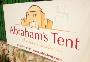 photo 5 Swastika painted on a sign advertising Abraham's Tent, across the street from Israel's Knesset, in Jerusalem. Photo: Abraham's Tent.