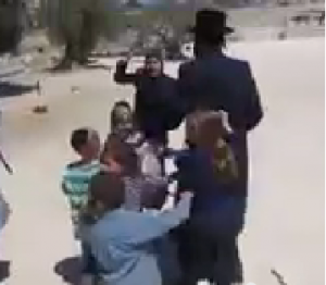 A Muslim woman verbally assaulting a family of religious Jews as part of a confrontation on the Temple Mount. Photo: Screenshot / YouTube.