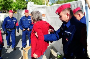 Photographs of sit-down protesters being removed by police in Budapest. Photo: Nepszabadsag Hungary.