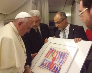 Pope Francis received an Agam Pope Francis being presented the Yaakov Agam painting. Photo: EL AL.