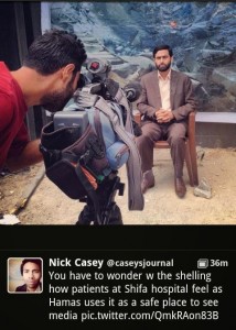 casey Mushir Al Masri, a Hamas MP and media spokesman, being interviewed by media in front of backdrop showing a destroyed house, and being filmed inside the Al Shifa hospital in Gaza. The photo was posted on Twitter by WSJ correspondent Nick Casey, and has since been removed. Photo: Screenshot.