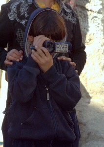 Palestinian youth, functioning as a B'tzelem photographer in Jerusalem. Illustration. Photo: Dave Bender Palestinian youth, functioning as a B'tzelem photographer in Jerusalem. Illustration. Photo: Dave Bender