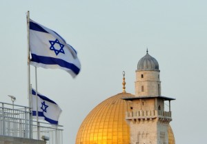 Israeli flags and Muslim minarets in Jerusalem's Old City. Photo: Dave Bender