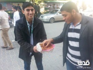 Gazans hand out candy after Jerusalem synagogue attack. Photo: IDF spokesman.