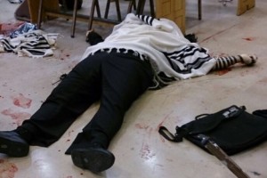 A victim of the Jerusalem synagogue terror attack lies wrapped in a prayer shawl and tefillin. Photo: Twitter. A victim of the Jerusalem synagogue terror attack lies wrapped in a prayer shawl and tefillin. Photo: Twitter.