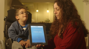 The Israeli-developed TalkITT software helps a boy with a speech impairment communicate "I love you." Photo: VoiceITT.
