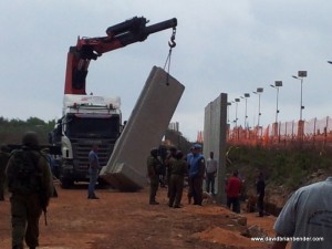 Israeli crane, IDF forces installing concrete anti-sniper barriers along Lebanon border near Kibbutz Manara in 2011 (illustration). Photo: Dave Bender.