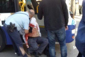 Medics treating victim of Tel Aviv bus stabbing attack. Photo: 0404 News.