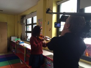 Cinematographer Bob Richman films Brianna at the Bronx Global Learning Institute for Girls. Photo: 'Joe's Violin' Facebook page.