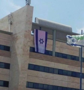 Employees of Orange placed an Israeli flag outside of their office building in Tel Aviv. Photo: Facebook.