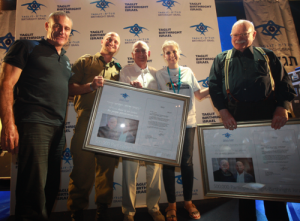 From left to right, Birthright CEO Gidi Mark, Staff Sgt. Shay Giladi from the IDF Search and Rescue Unit, philanthropist Charles Bronfman, Birthright's 500,000th trip participant Molly Dodd, and philanthropist Michael Steinhardt. Dodd presented the founders with framed letters from Israeli Prime Minister Benjamin Netanyahu from 1998, in which he gave his blessing for Birthright to begin. Photo: Erez Uzir.