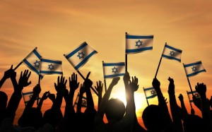 Celebrating the Jewish state with Israeli flags. Photo: Wikimedia Commons.
