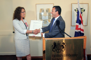 Prof. Rivka Carmi receives honorary Commander of the British Empire medal on Monday June 9, 2015. Photo: Hanoch Grizitzky.