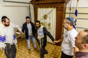 Rabbi Shimon Grady (pictured in center) dances with community members at the "sanctuary" he leads on Maryland's lower eastern shore. Photo: Courtesy Rabbi Shimon Grady.