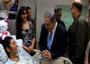 Liron Yisraeli, the female Border Guard stabbed in the neck by a Palestinian attacker, tells her story to Prime Minister Netanyahu and Defense Minister Yaalon. PHOTO: Channel 2 News