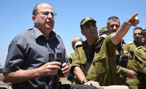 Defense Minister Moshe Yaalon, pictured in the grey shirt, hinted that Israel would carry out a strike against Iran's nuclear facilities. PHOTO: Eden Moldovsky/Ministry of Defense.