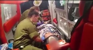IDF medics treated a Palestinian boy discovered with head injuries. Photo: Screenshot.
