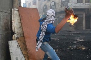 Palestinians are caught on video sneaking into Israeli towns and throwing molotov cocktails.PHOTO:EPA/ABED AL HASHLAMOUN