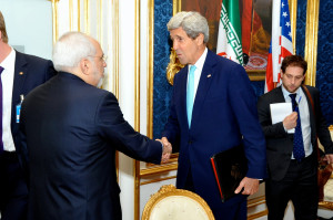 Secretary of State John Kerry shaking hands with his Iranian counterpart, Iranian Foreign Minister Javad Zarif. Photo: Wikimedia Commons.