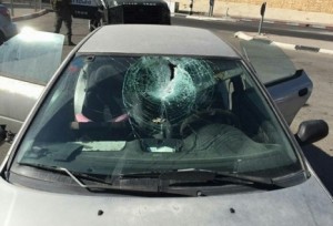 An Israeli couple and their infant daughter emerged unscathed, after their car was hit in a recent rock-throwing attack near the Palestinian village of Beit Sahur. Photo: Hatzolah Judea and Samaria. 