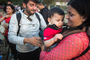 A Syrian refugee with a baby sling donated by Israelis. Photo: IsraAid.