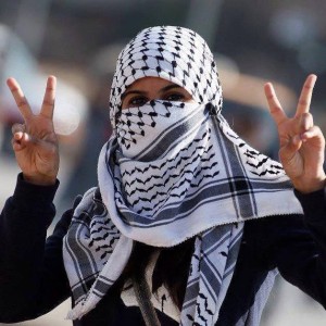 A Palestinian woman making the victory sign. Photo: from the Facebook page, "Palestine Belongs to Palestinians!"