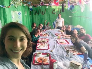 Eliana Rudee in the sukkah with her ulpan classmates. Photo: Courtesy Eliana Rudee.