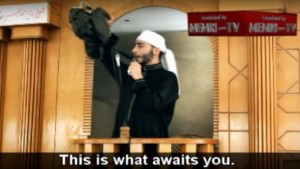 A Gaza preacher  identified as Abu Hamza Ashur waves a suicide belt during a sermon on October 23, 2015. Photo: Screenshot. 