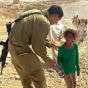 IDF soldir Evyatar Ofri gave a box of cereal to a young Arab girl who was desperate for food. Photo: Facebook.