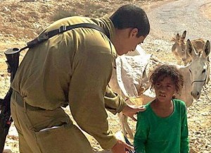 IDF soldir Evyatar Ofri gave a box of cereal to an Arab child searching for food. Photo: Facebook.