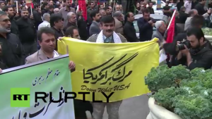 Protesters in Iran hold banners that read "Down with U.S.A." Photo: Screenshot.