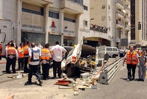 The aftermath of a 2008 bulldozer attack that killed 3 Israelis and the Arab attacker. Photo: Wikipedia.