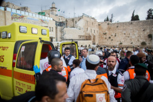 Ambulances at the Western Wall evacuate injured Israelis following a terror attack where a Palestinian woman stabbed an Israeli man near Lions’ Gate of Jerusalem's Old City on October 07, 2015. Photo by Yonatan Sindel/Flash90.