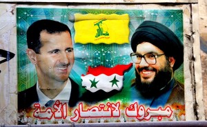 A poster of Syrian President Bashar al-Assad (left) with Hezbollah leader Hassan Nasrallah. Photo: Wikipedia.