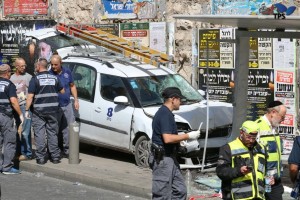 The Bezeq vehicle an east Jerusalem man used to ram a bus stop on Malchei Yisrael Street in Jerusalem. Photo: Hillel Maier, TPS