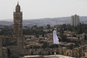 A white bridal dress floats in the air near the Tower of David as part of the 2nd Jerusalem Biennale's installation called "Betrothal." Photo: Ricky Rachman.