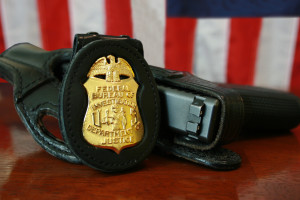 FBI badge and gun. Photo: Wikipedia.