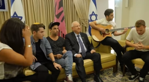 Israeli President Reuven Rivlin with a group of young Israelis singing a song of coexistence. Photo: YouTube screenshot.