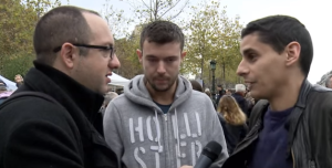 Zvika Klein (far left), interviewing two people in Paris, a few days after the attacks. Photo: YouTube/Screenshot.
