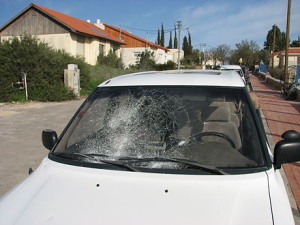 The shattered windshield of an Israeli car, attacked by Palestinian rock-throwers.  Photo: Wikipedia.