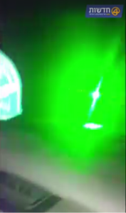 The light from a green laser pointer -- the kind Palestinians have been using to blind Israeli drivers. Photo: Screenshot.